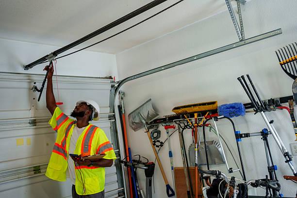 Professional Garage Door Spring Repair technician working in Lauderdale Lakes, WI